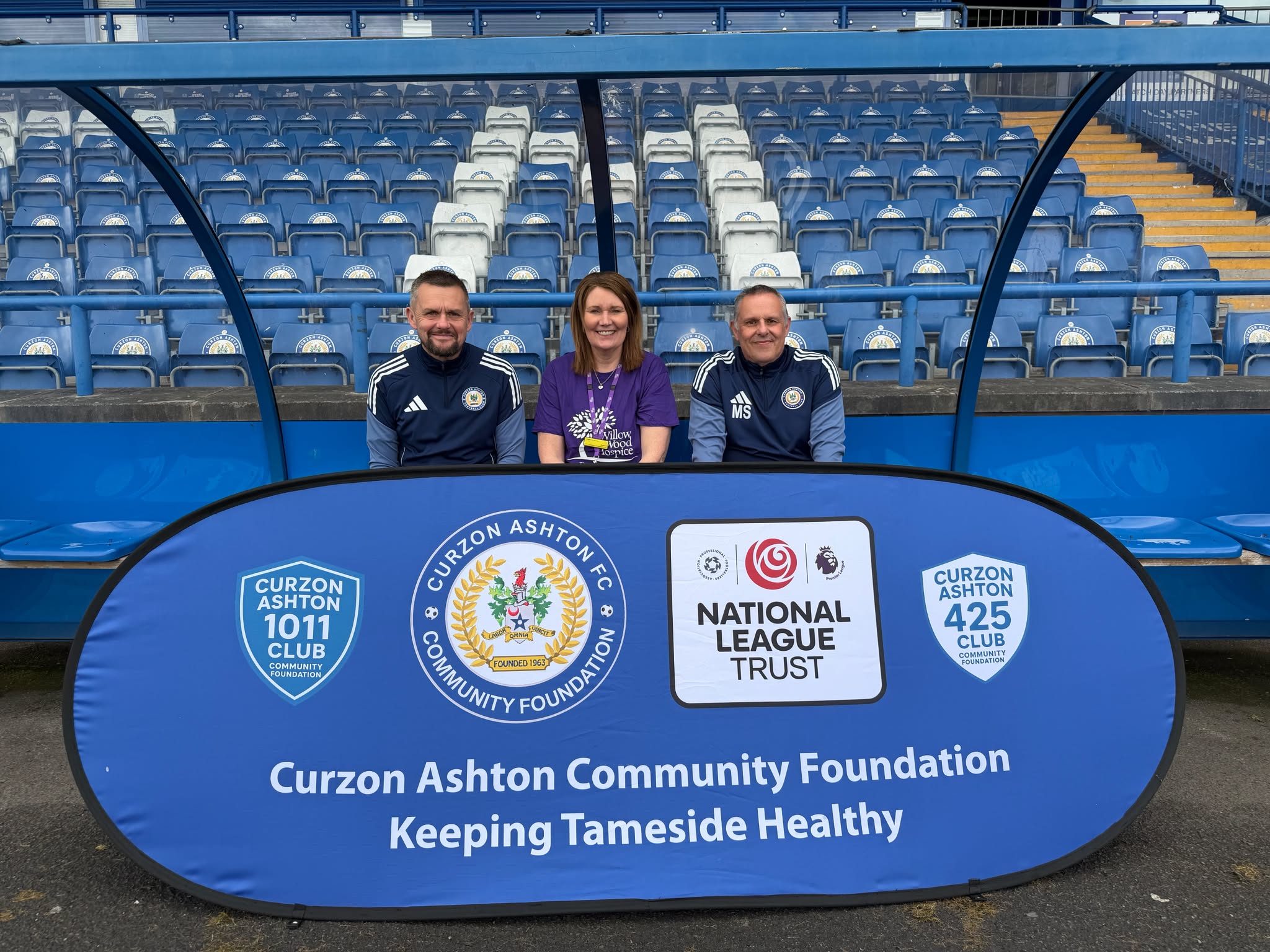Joanne Lees from Willow Wood Hospice with Richard Twamley (left) and Mike Smith from Curzon Ashton FC.