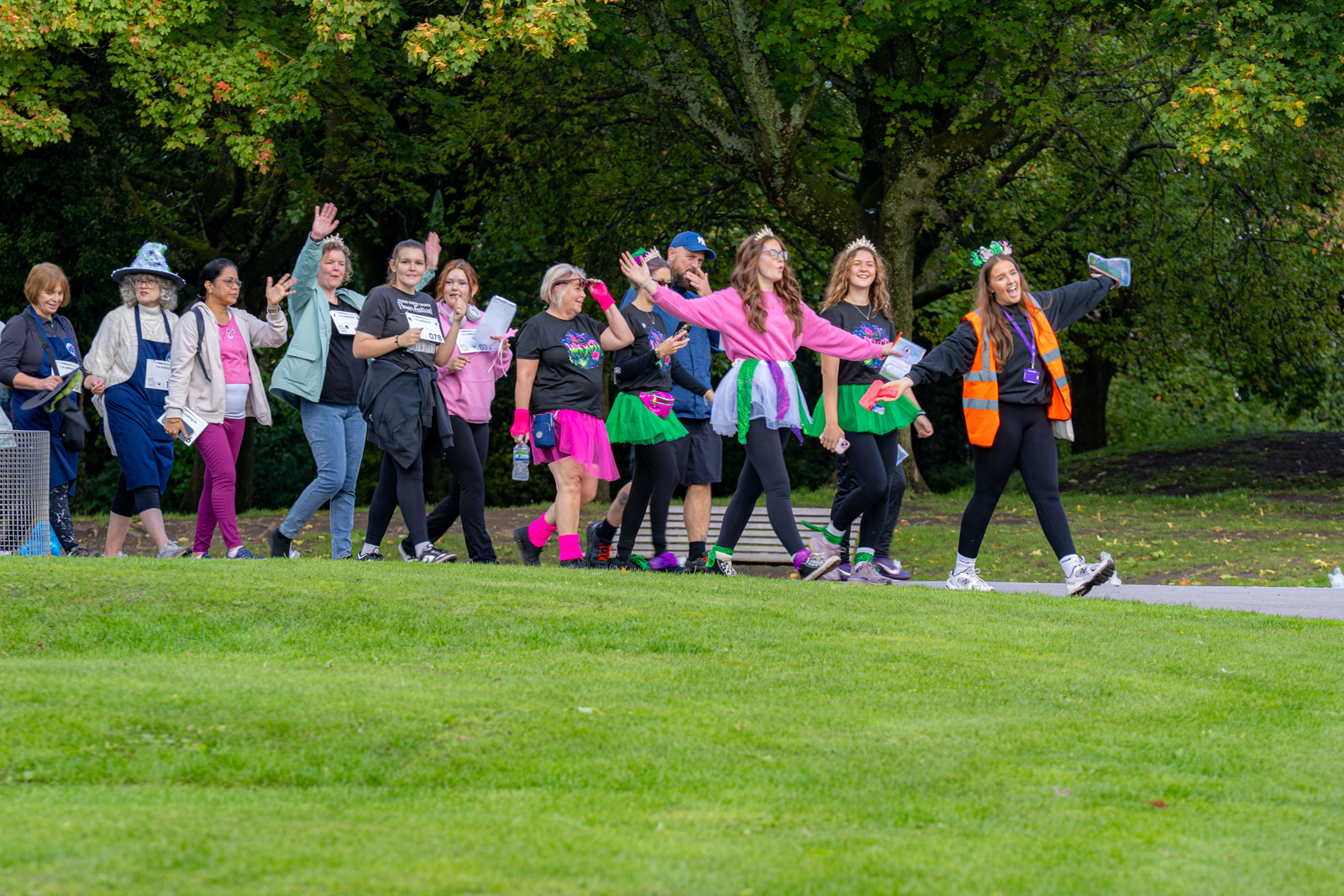 Enthusiastic walkers enjoying the walk through Stamford Park