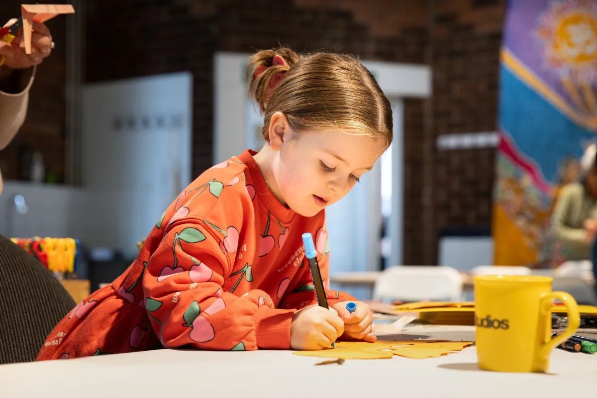 A girl colouring in