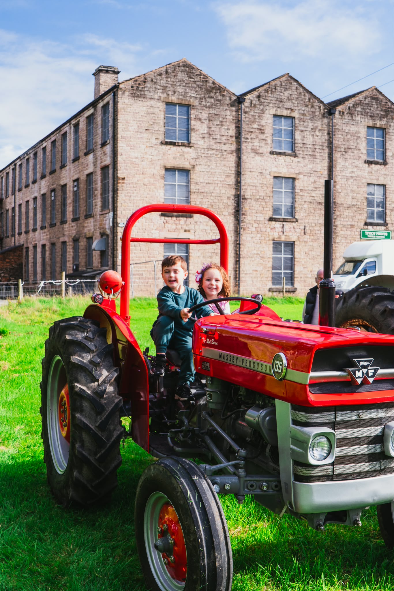 Two children on a tractor in Mottram